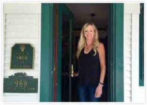 Innkeeper Jan Smith of Maple Cove B&B opens the door to guests