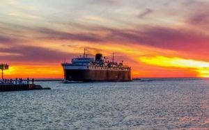 The SS Badger ferry pulls into Ludington at sunset