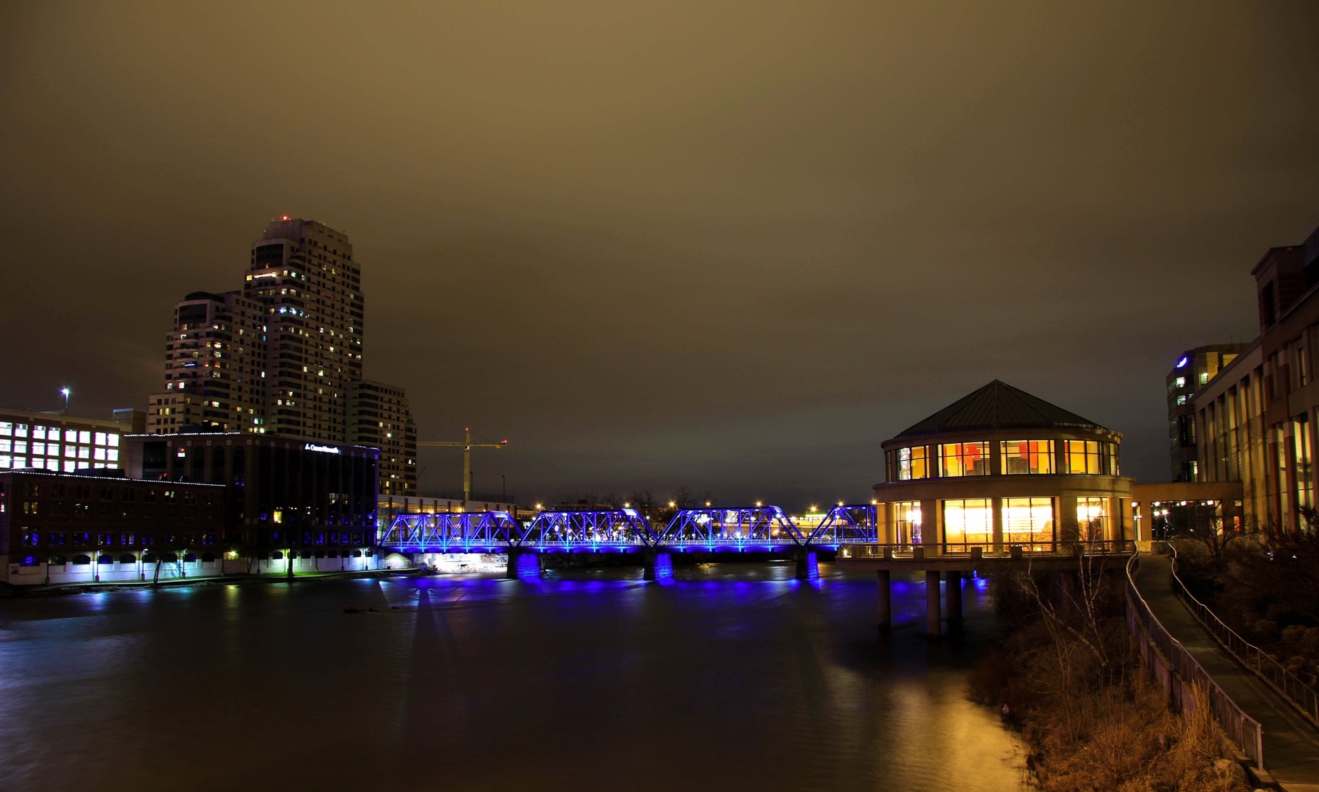 Grand Rapids at night with blue bridgw