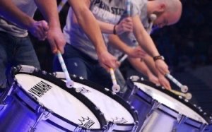 Close-up of drummers during a concert