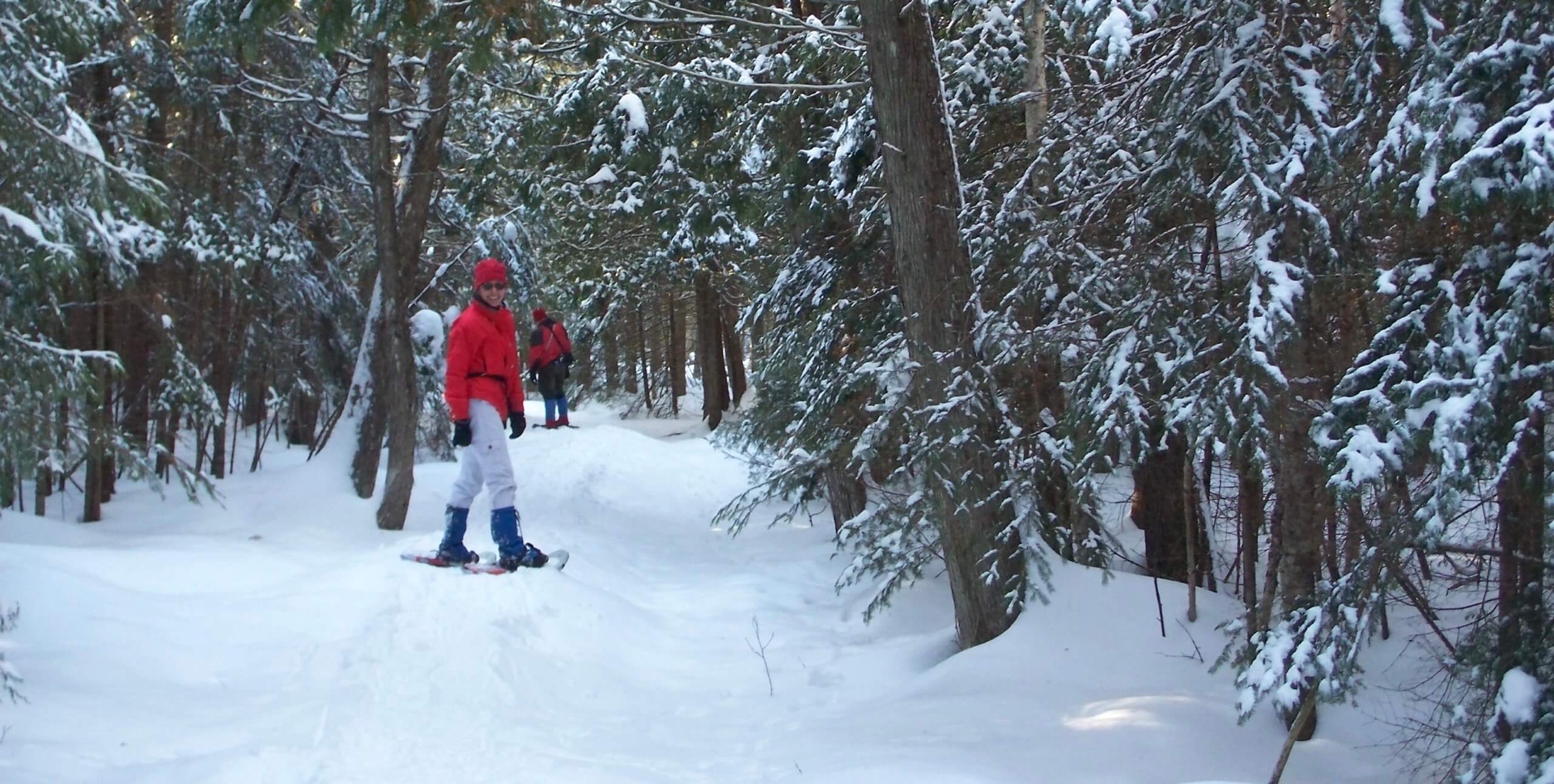 Two people snowshoeing in Pigeon River Forest