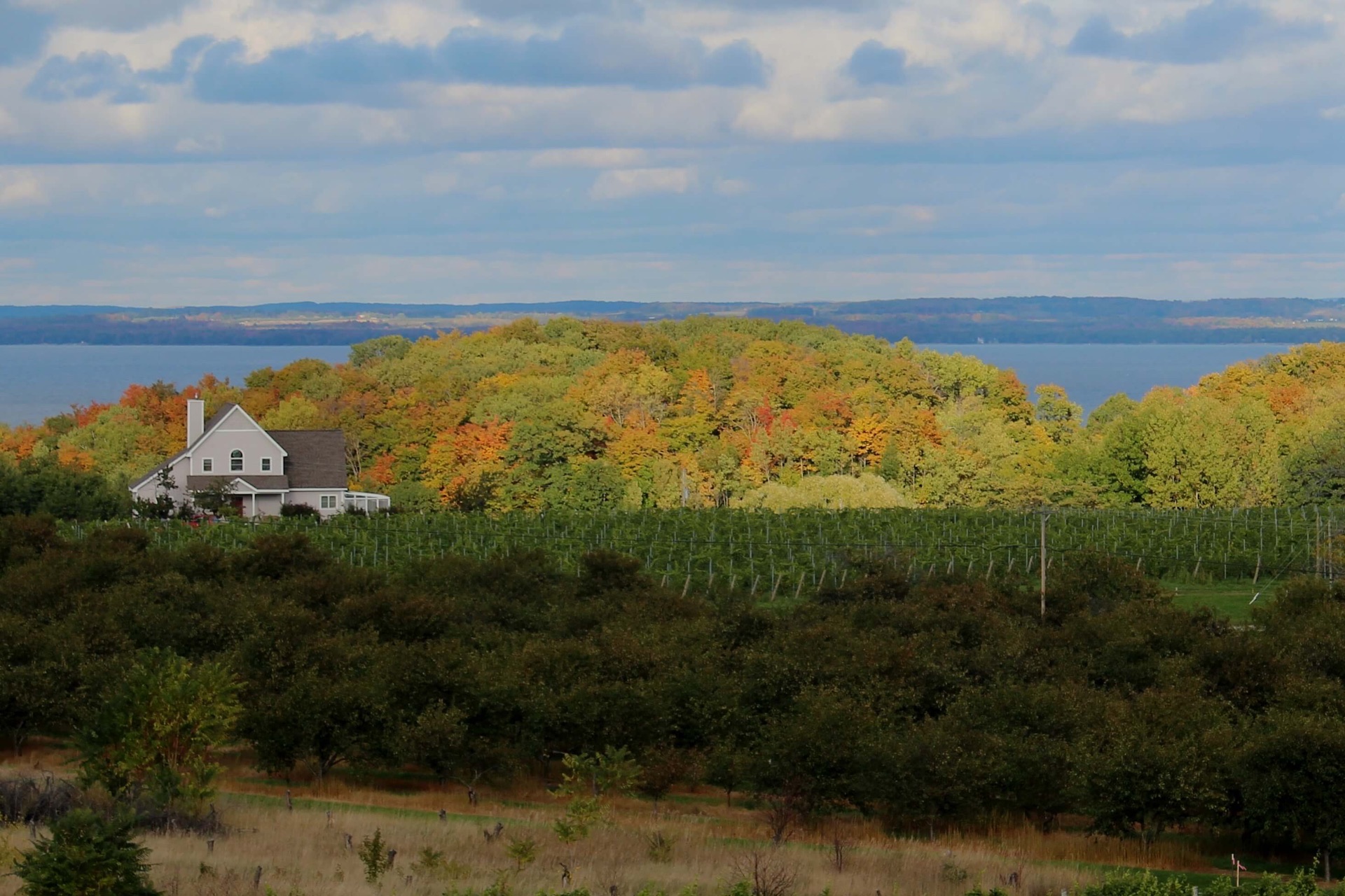 View from Chateau Chantal as sunrise shines on early autumn scene and Grand Traverse Bay
