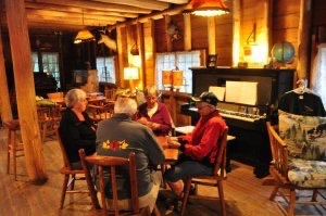 Group plays cards at Presque Isle Lodge