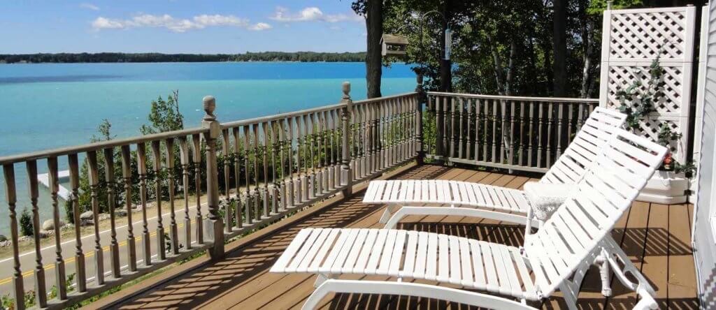 Chaise lounges on porch at Torch Lake B&B