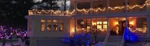 Holiday lights adorn the porches at Hexagon House