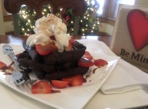 Chocolate waffles with strawberries and whipped cream as served at Bear Lake B&B