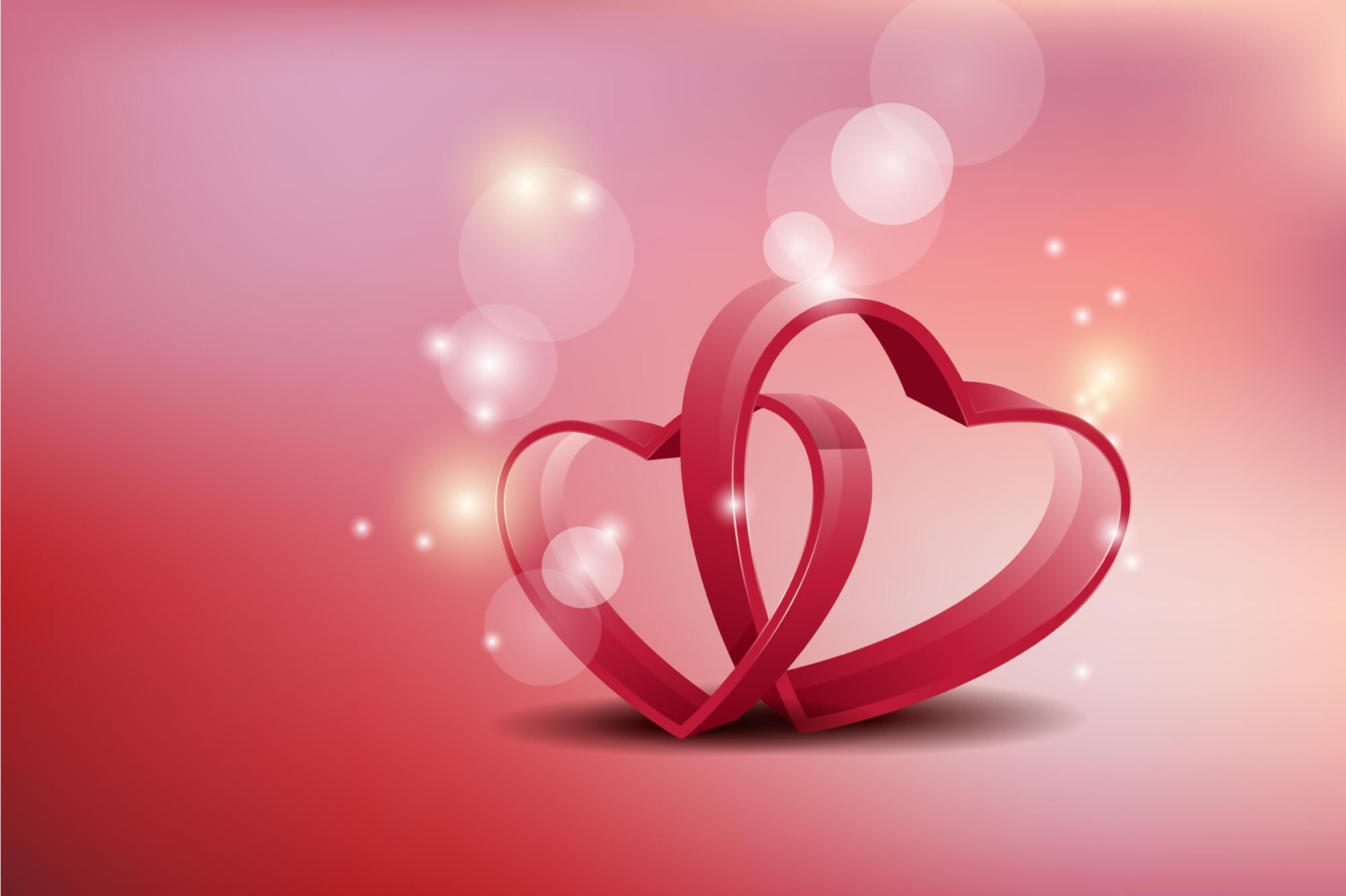 Romantic Valentines Getaway graphic of 2 entwined hearts with spheres and starts glowing all around.