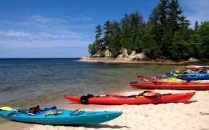 Colorful kayaks sitting on a beach