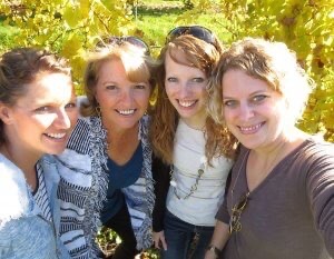 Four women who enjoyed a wine tour weekend at Glen Arbor B&B