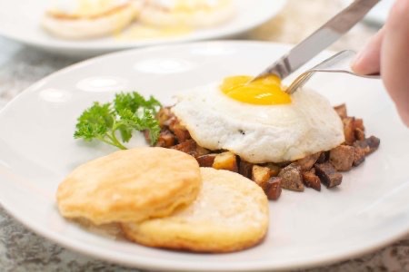 Poatato Hash with Sunny Side up Egg and biscuits