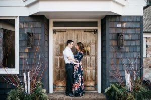 A young couple embrace outside B&B at The Morris Estate
