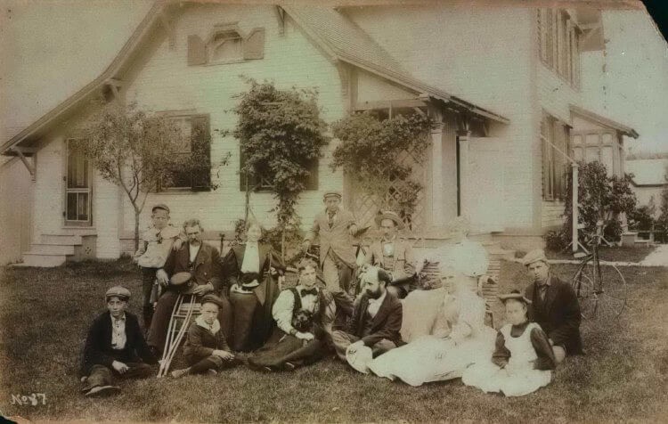 Keeper James Samuel Donahue, the man with crutches, and family members pose in front of the South Haven Keeper’s Dwelling. Photo courtesy of Michigan Maritime Museum.