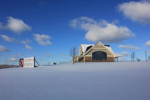 The main building of 12 Corners Winery sits on a snow-covered hill in winter