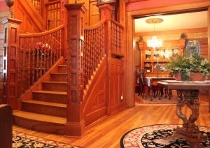 Gleaming woodwork in foyer and on the stairway.