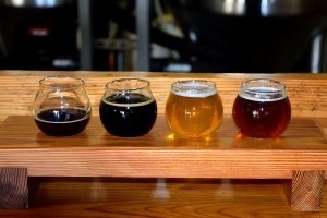 Beer tasting flight in four short glasses