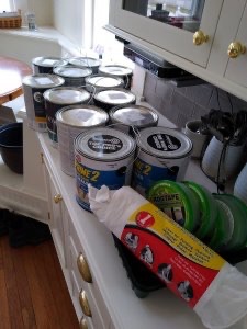 Array of paint cans and painting gear