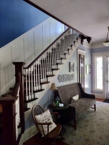 After painting, the walls of the foyer are two shades of blue