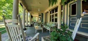 Beautiful outdoor spaces at B&Bs. Rocking chairs and other seating on the covered front porch of Saravilla B&B.
