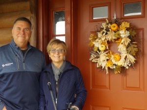 Mike and Liz Clancy at the front door of LogHaven B&B