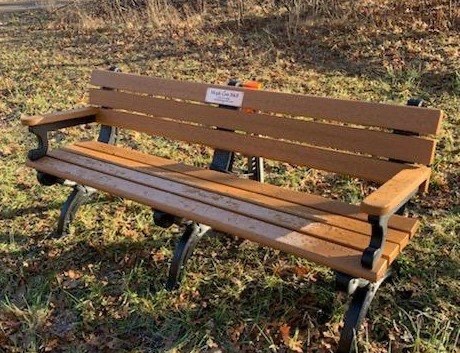 A bench alongside a trail
