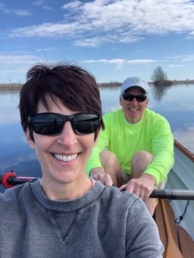 Debi and Greg Hillebrand sit in a rowboat