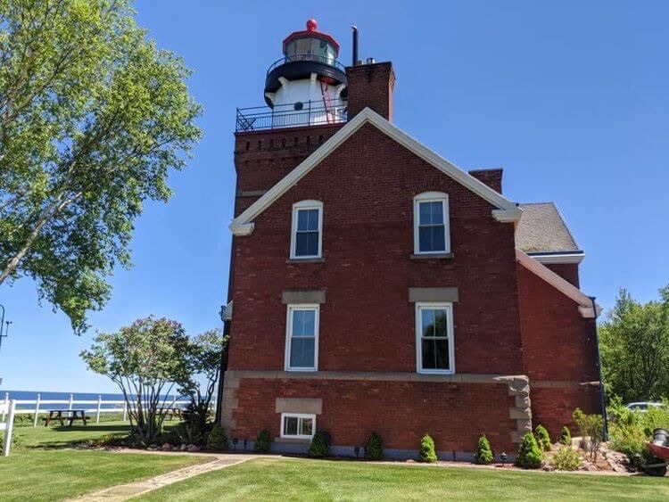 Big Bay Point Lighthouse exterior, of our B&Bs near Michigan lighthouses, this is the very closest because the lighthouse is a B&B. 