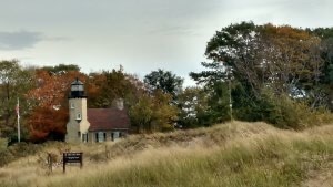 White River Light Station Museum viewed from across the channel connecting White Lake and Lake Michigan