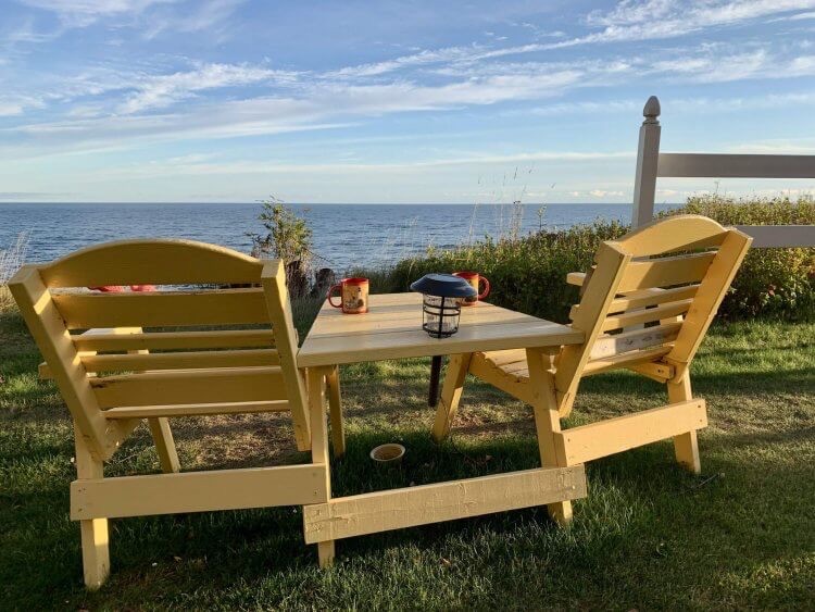 Beautiful outdoor spaces at Michigan B&Bs: Adirondack chairs overlooking Lake Superior at Big Bay Point Lighthouse