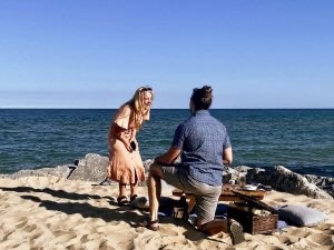 Man, woman and a beachfront proposal at Huron House