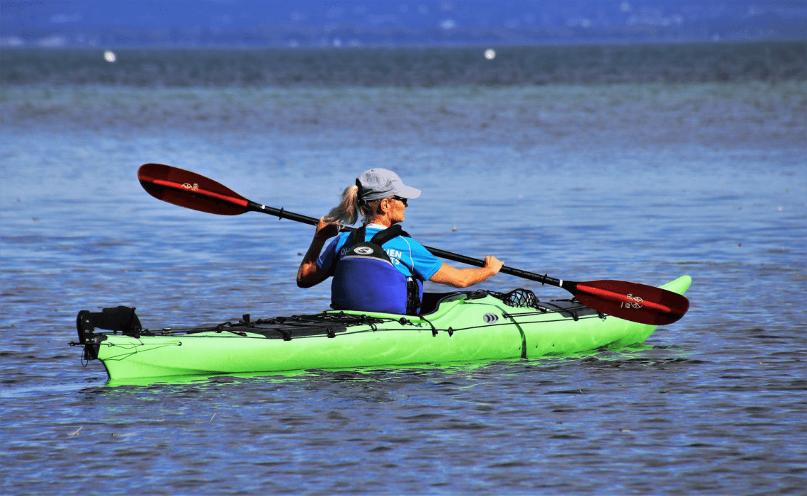 Colored Kayaks on a Lake