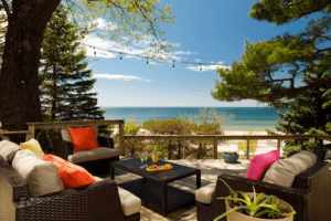 Patio furniture with beach beyond