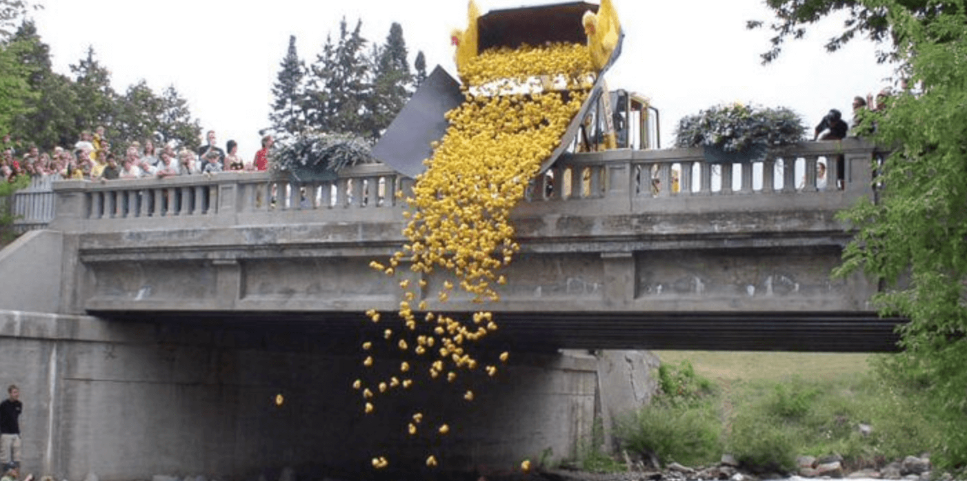 Truck dumping rubber duckies in the River