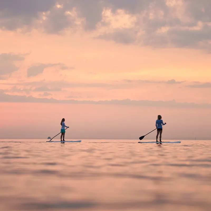 Paddle boarding on Lake Michigan at Sunset