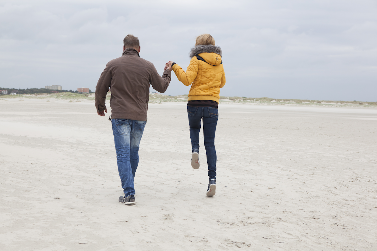 Couple walking the beach