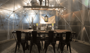 Igloo with a dining table and chair at HomeGrownBrewingCo