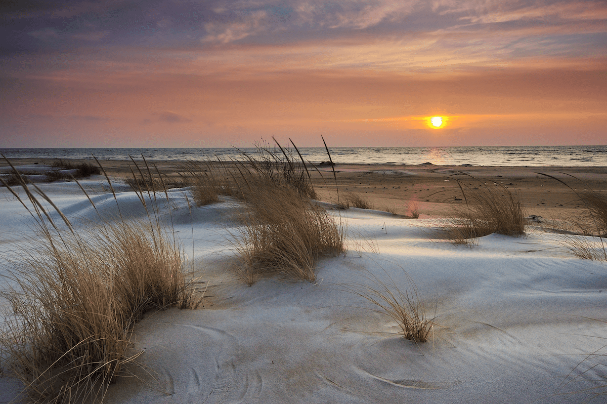 Sunrise over Lake Huron with a snow dusting on the sand