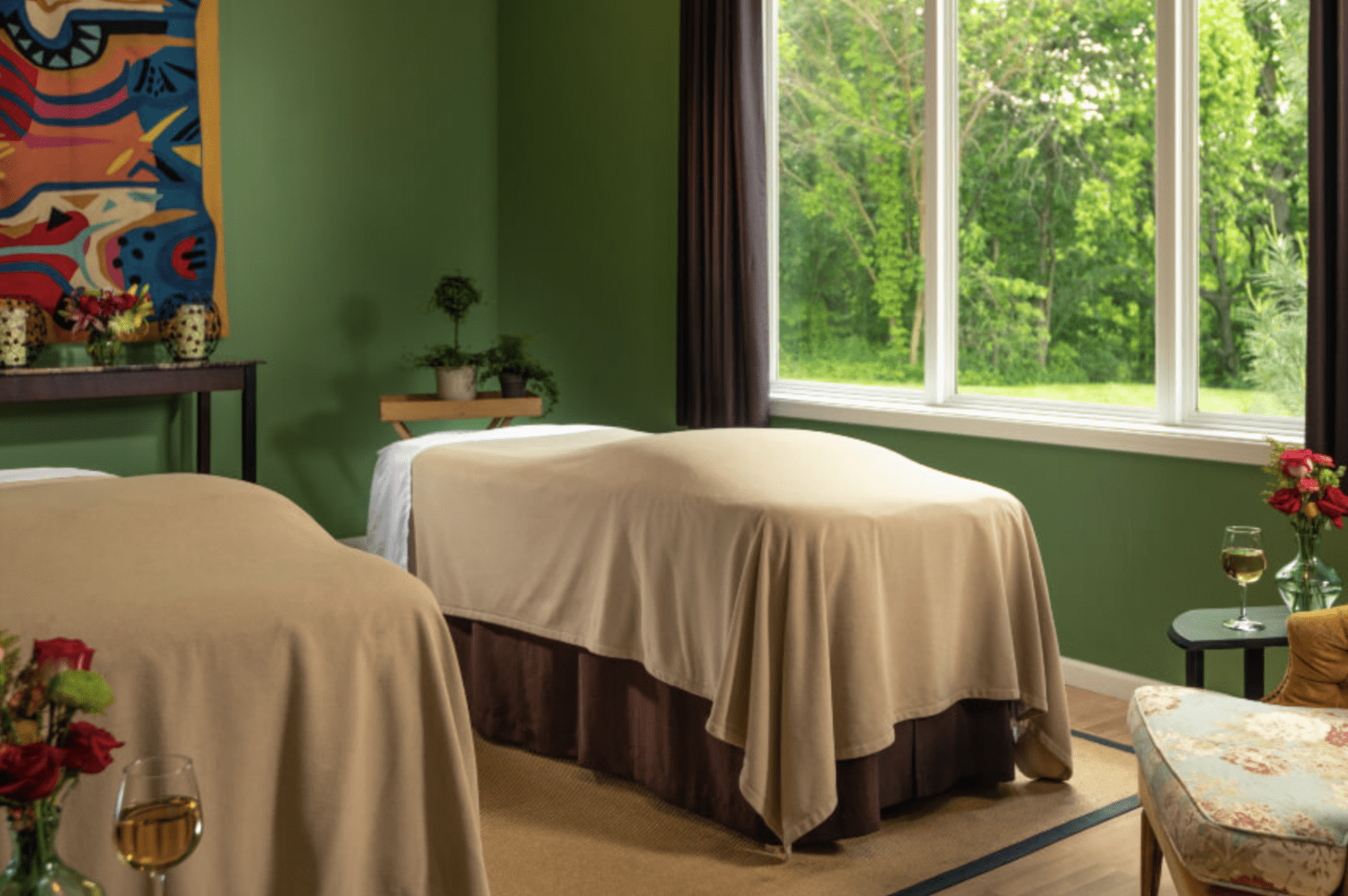 Two spa tables with a window showing greenery