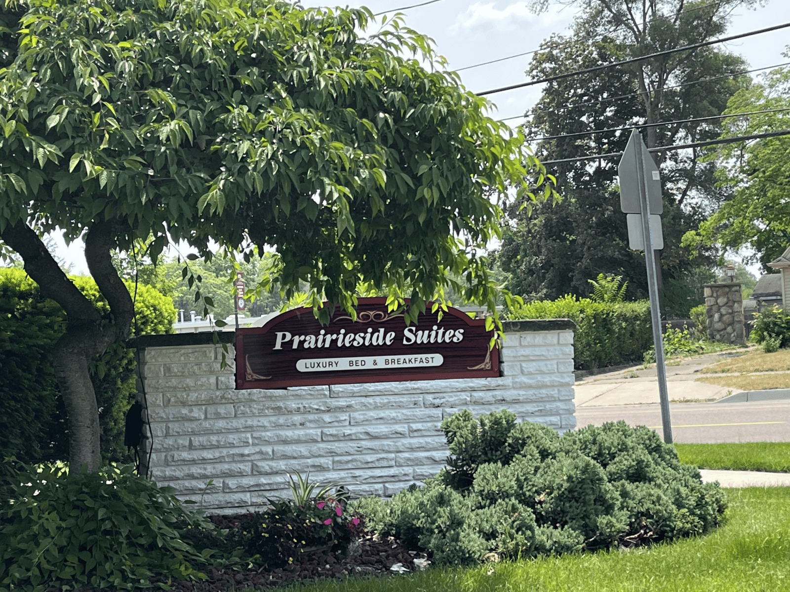 Prairieside Suites Sign on a Brick Wall