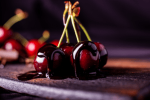 A stem of Cherries that have dipped in chocolate- from the Countryermitage
