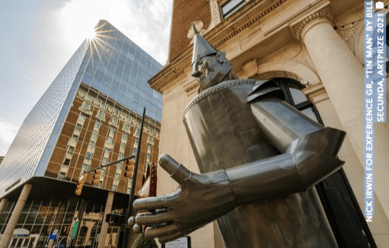 Tin metal sculpture with tall building behind- Art Prize-Grand Rapids