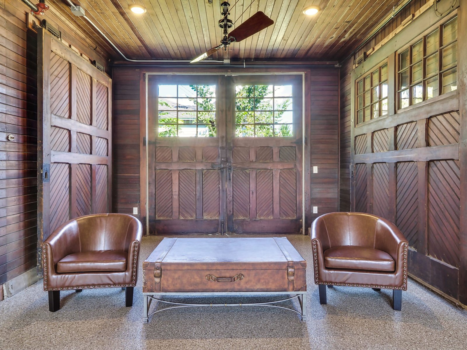 two leather brown club chairs in the Carriage House at the Cartier Mansion