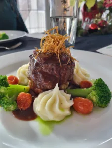 Filet of beef beautiful garnished with brocoli and mashed potatoes