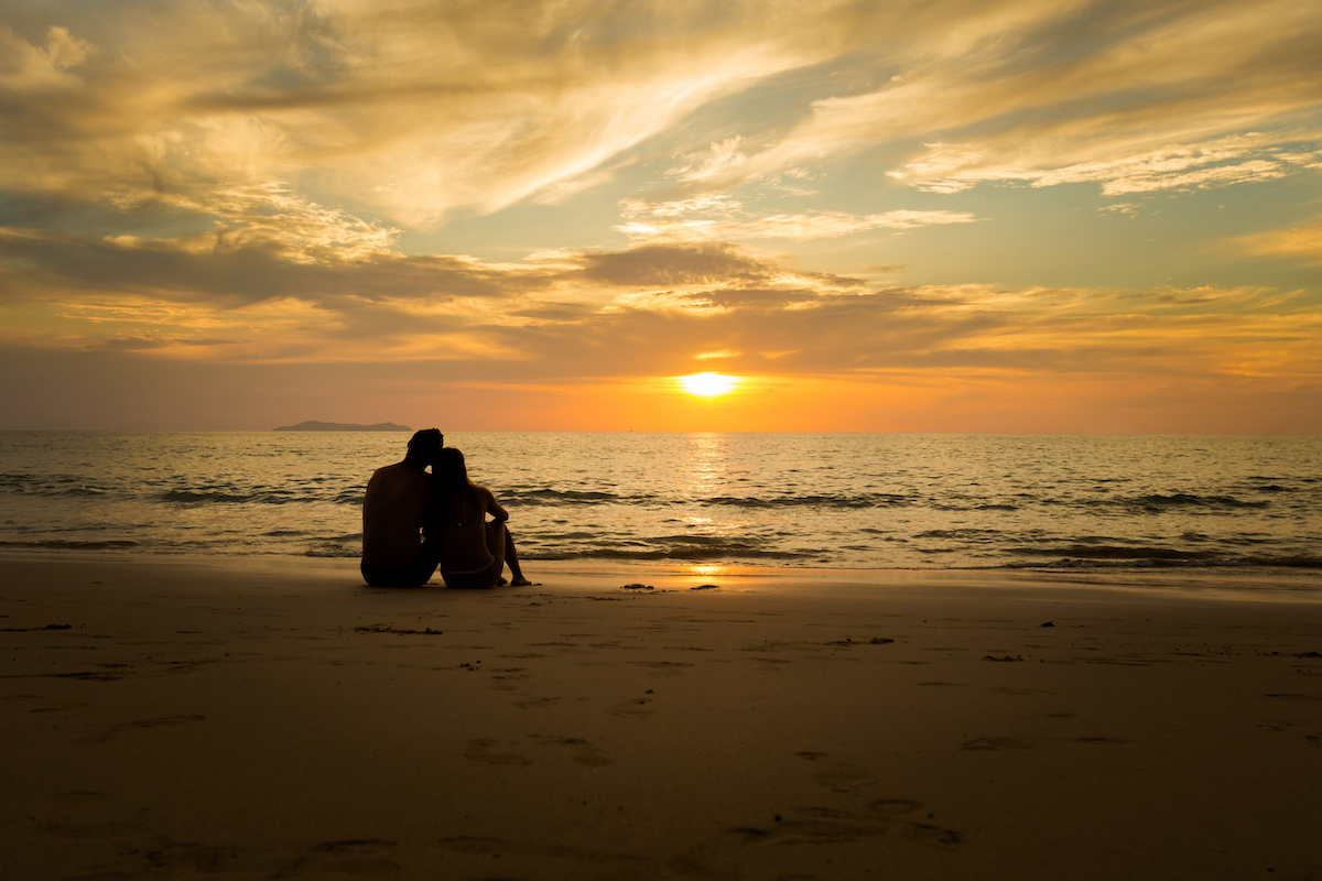 Couple on a beach at sunset